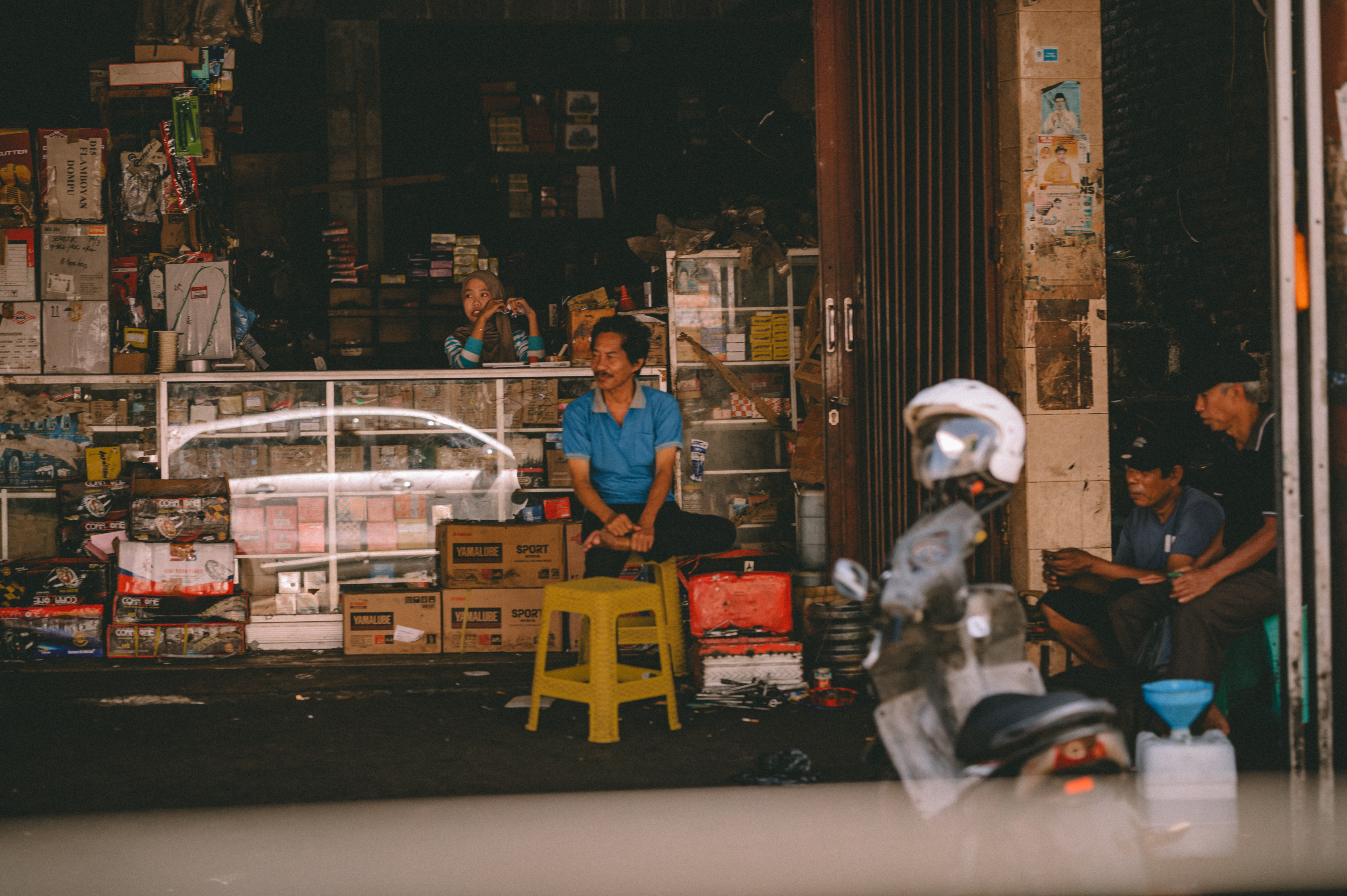 People outside a small roadside shop
