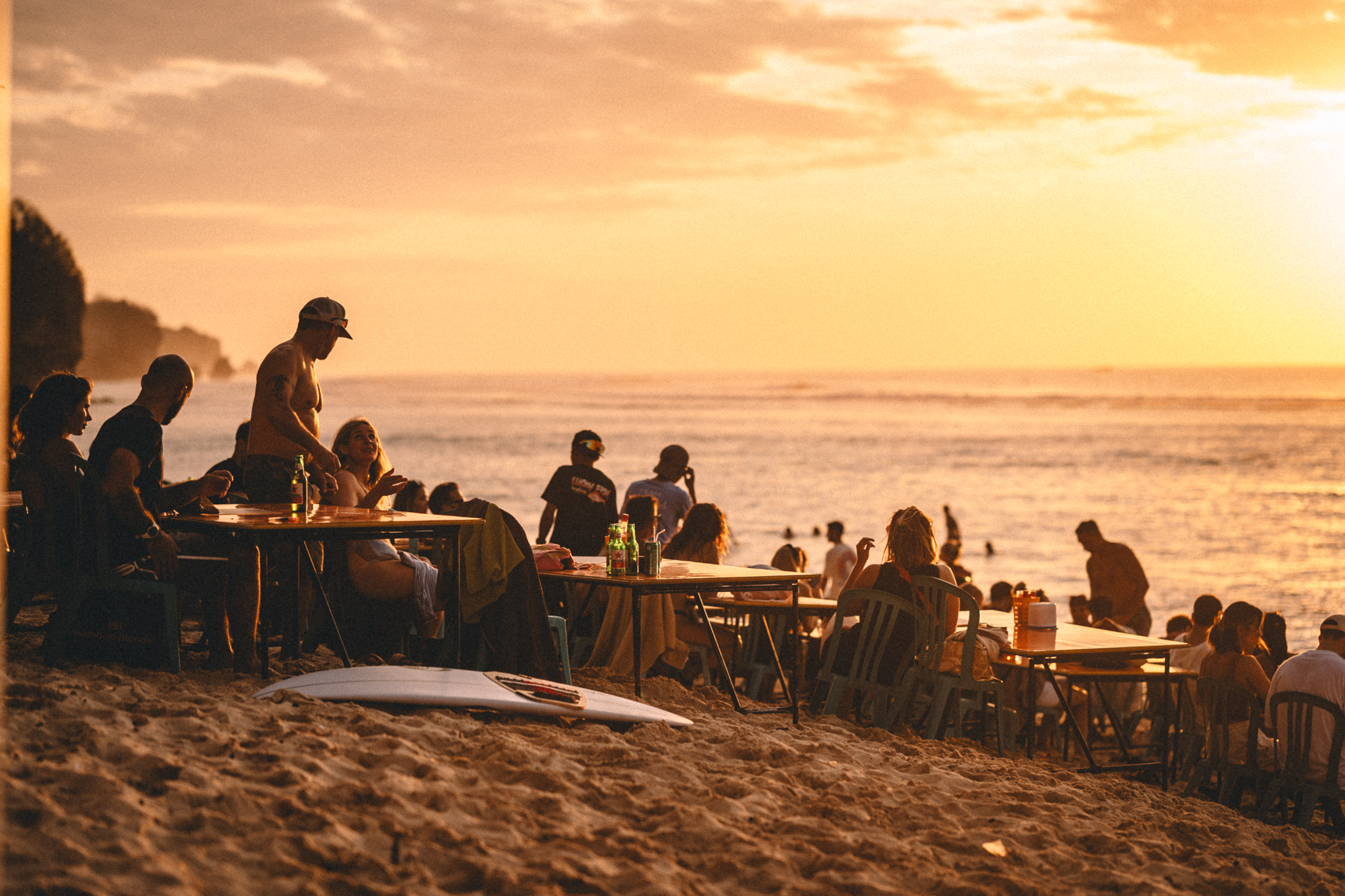 A group by the sea during a golden sunset