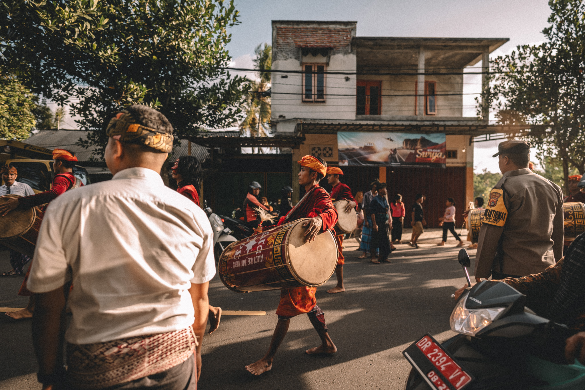 Musicians and spectators on a village street