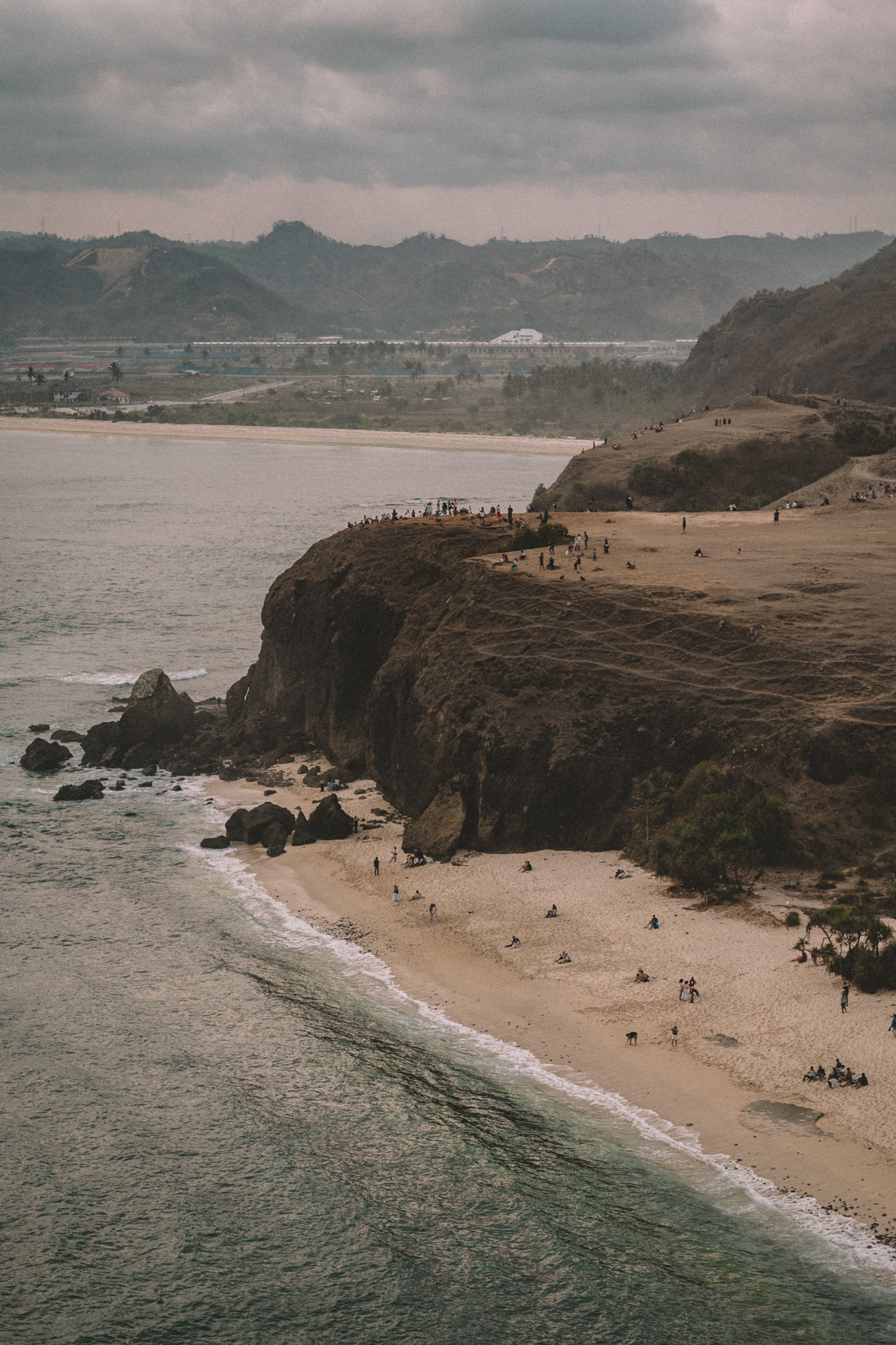 A beach and headland viewed from above
